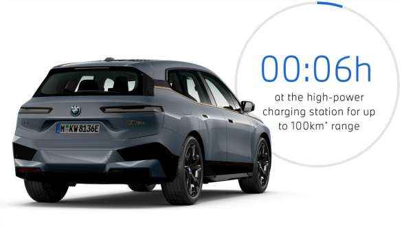 BMW iX M60 i20 2022 electric SUV BMW Individual Storm Bay metallic three-quarter rear view with charging time graphic