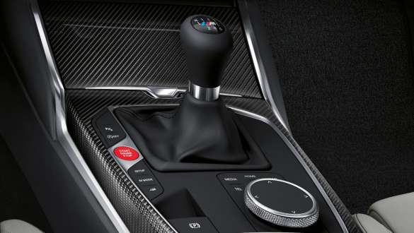 Manual M transmission and rear-wheel drive BMW M4 Coupé G82 2020 BMW M4 Coupé G82 2020 Manual 6-speed M transmission and rear-wheel drive close-up centre concole and gear lever