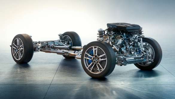 M specific suspension BMW X4 M Competition F98 LCI Facelift 2021 BMW X4 M Competition F98 LCI Facelift 2021 M specific suspension side view with burnout under bridges