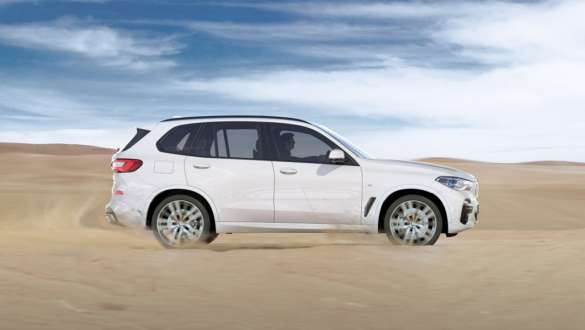 Driving mode xSand BMW X5 SUV G05 Driving mode xSand BMW X5 SUV G05 2018 Mineral White metallic side view driving on sand