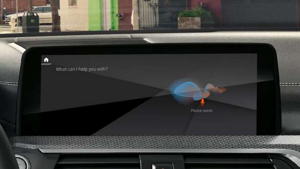 Remote Software Upgrade BMW X5 SUV G05 Woman drinking a cup of coffee while she updates the software of her BMW X5 SUV via Remote Software Upgrade G05 2018