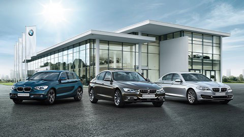 BMW used cars in front of BMW dealership BMW used cars in front of BMW dealership