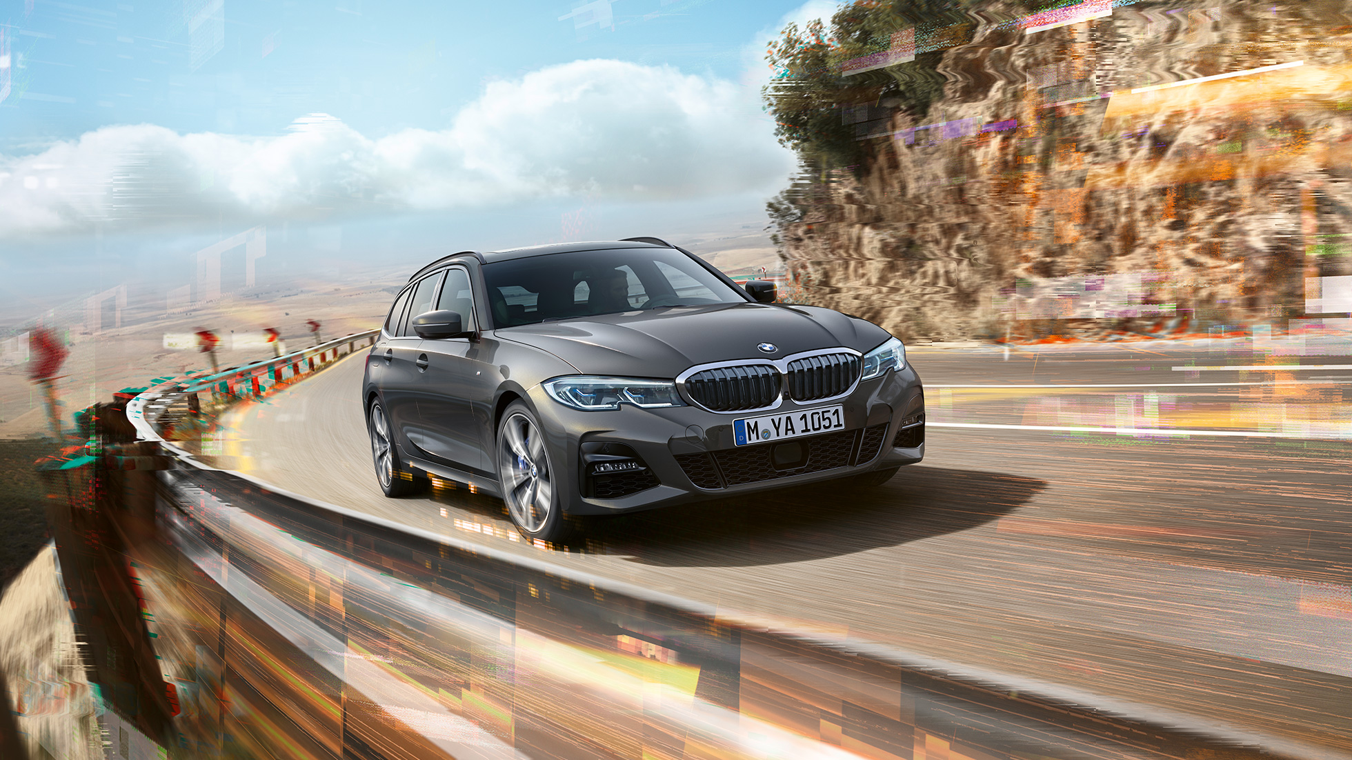 BMW 3 Series Touring G21, three-quarter front shot design BMW 3 Series Touring G21, three-quarter front shot driving on bridge in front of rural surroundings