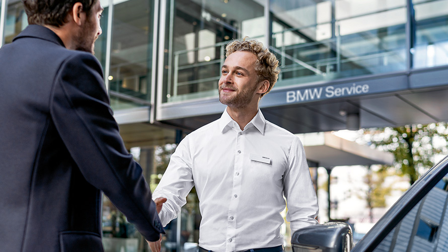 BMW Service employee welcomes customers