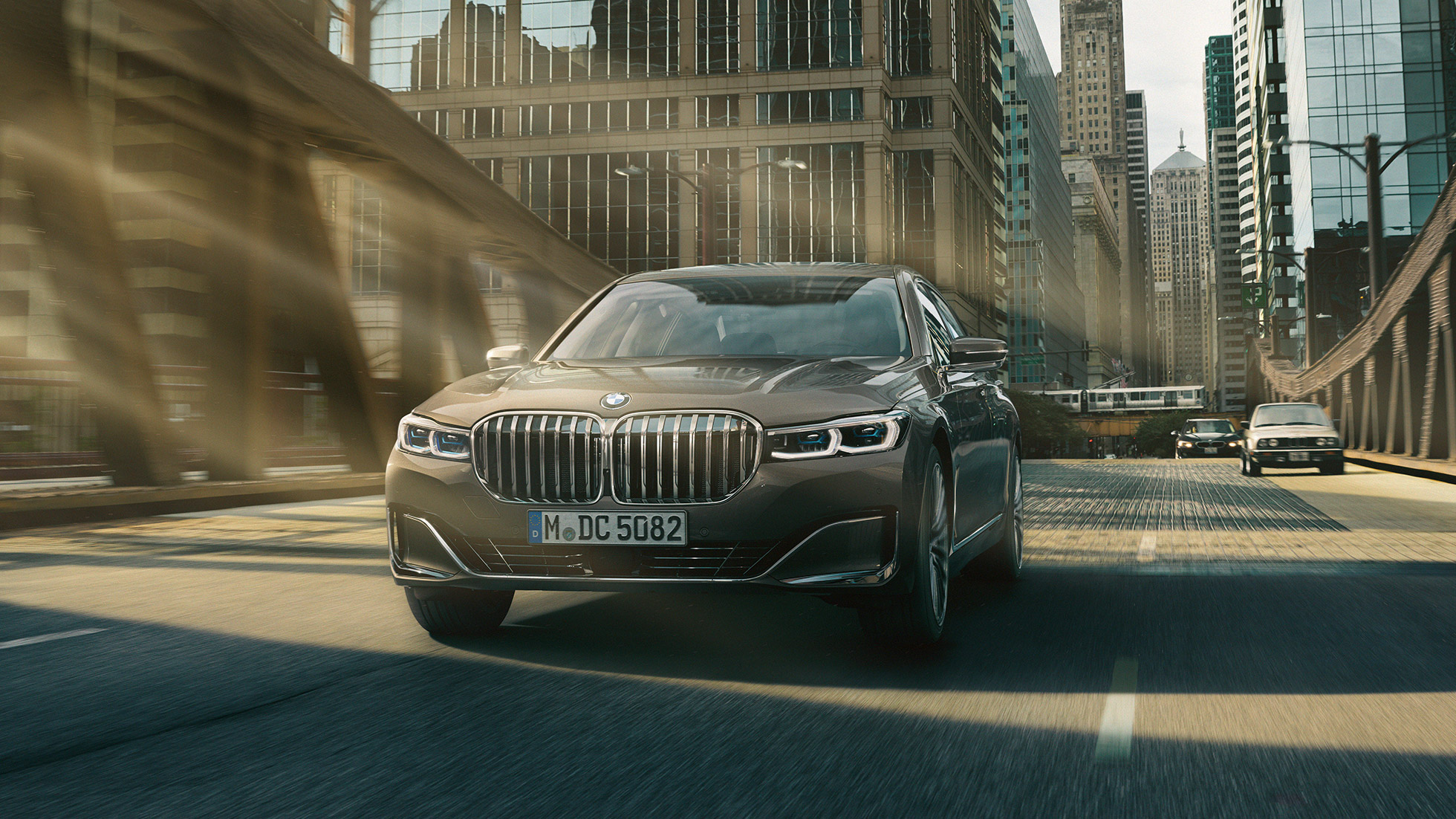 BMW 7 Series Sedan G11 Driving Assistance Systems Driving Assistance Systems G11: BMW 7 Series Sedan driving in front of urban setting