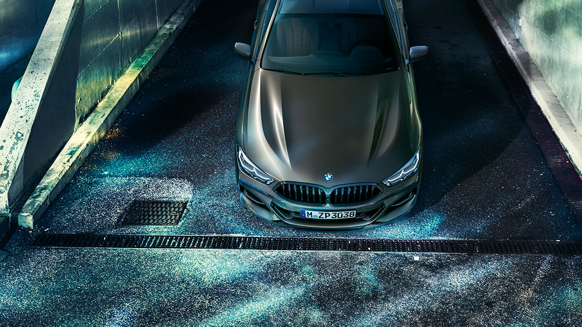 Front still shot of the BMW 8 Series Coupé G15. Front still shot of the BMW 8 Series Coupé with BMW Individual equipment in an urban setting at night G15.