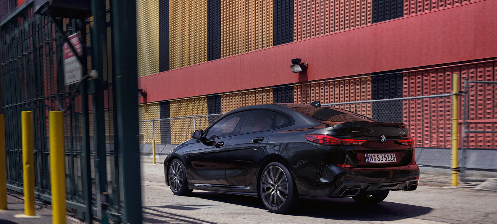 BMW M235i xDrive Gran Coupé three-quarter side view F44 BMW M235i xDrive Gran Coupé Black Sapphire metallic F44 three-quarter side view