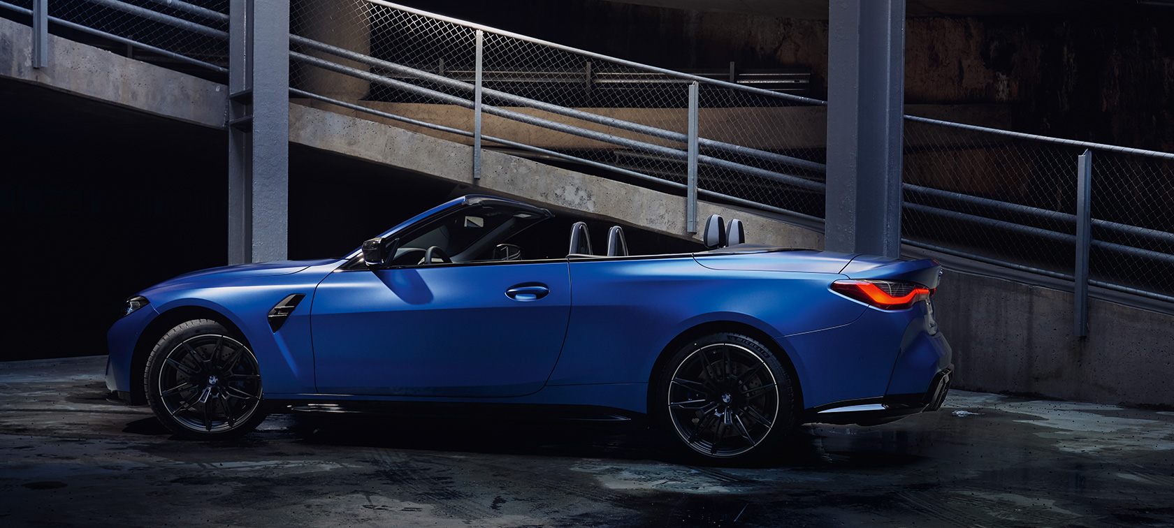 BMW M4 Competition Convertible with M xDrive G83 2021 side view standing BMW M4 Competition Convertible with M xDrive G83 2021 BMW Individual Frozen Portimao Blue metallic side view standing