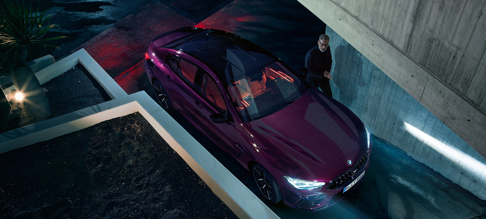 BMW M8 Competition Gran Coupé birds-eye view F93 BMW M8 Competition Gran Coupé F93 2020 BMW Individual Ametrine metallic three-quarter standing in front of a building birds-eye view