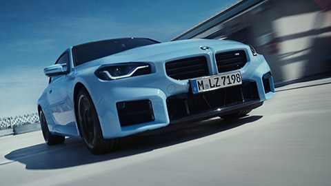 BMW M2 G87 front view driving on the street BMW M Series BMW M2 G87 front view driving on the street