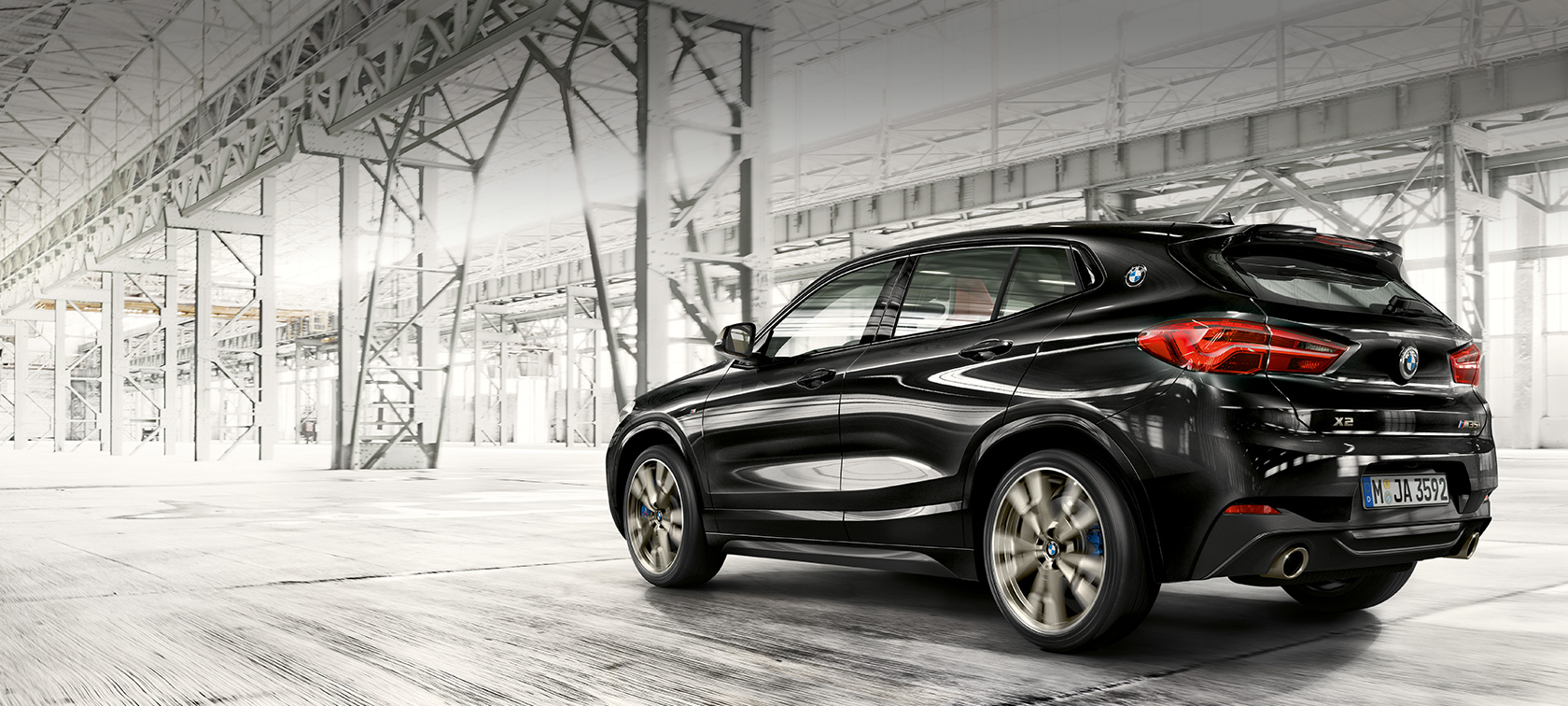 Three-quarter rear view BMW X2 M35i SUV F39 BMW X2 M35i SUV Sapphire Black metallic F39 Three-quarter rear view