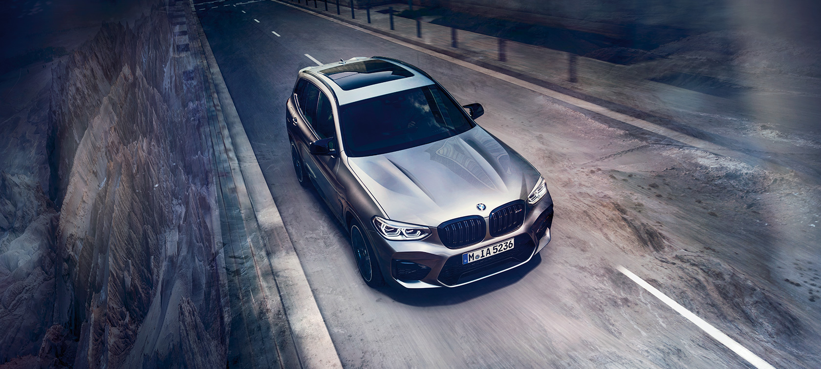 BMW X3 M Competition SUV, bird’s eye view F97. BMW X3 M Competition SUV in Donington Grey metallic, exterior, bird’s eye view of front F97.