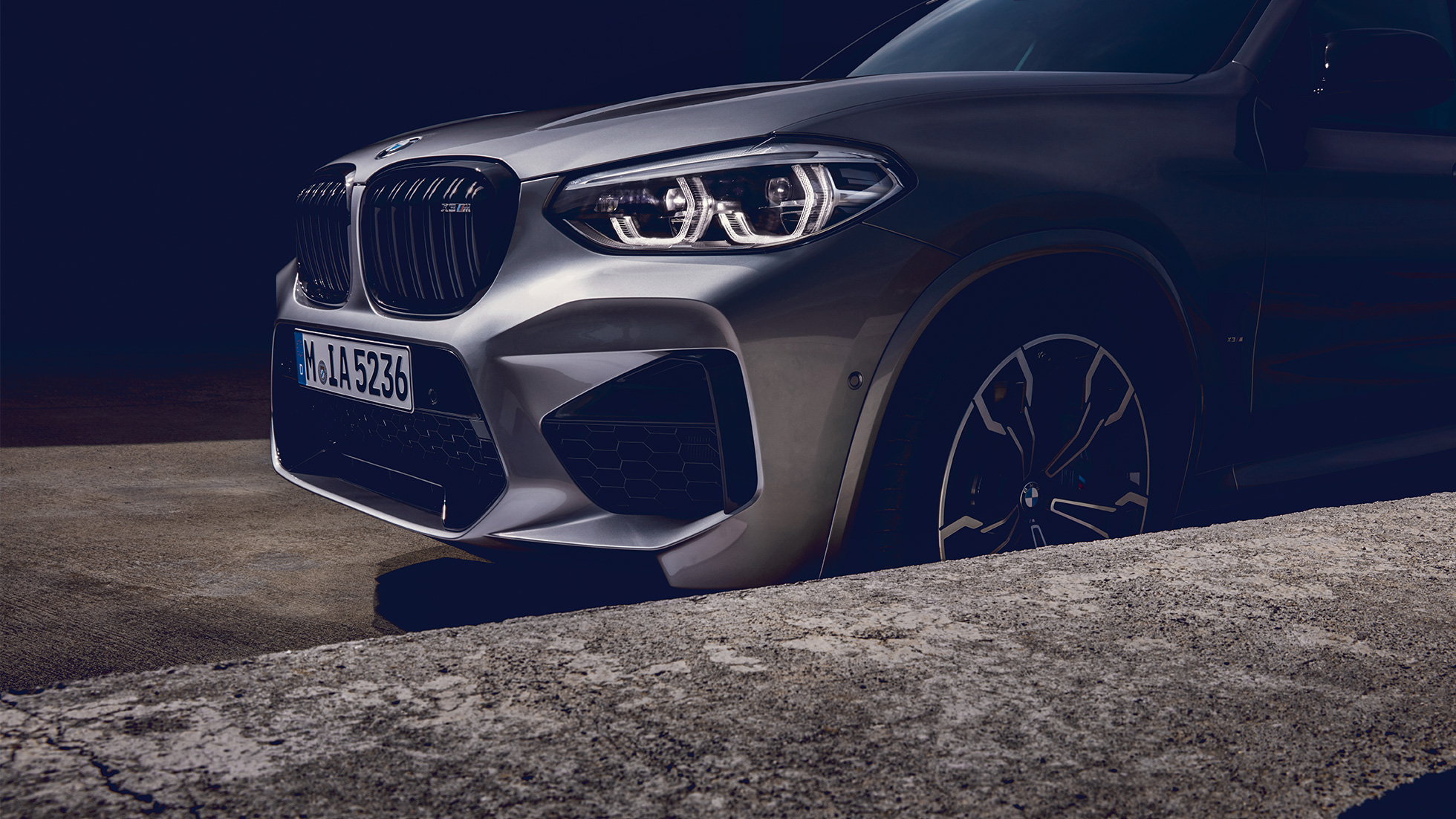 BMW X3 M Competition SUV, lateral front view F97. BMW X3 M Competition SUV in Donington Grey metallic, exterior, lateral front view F97.