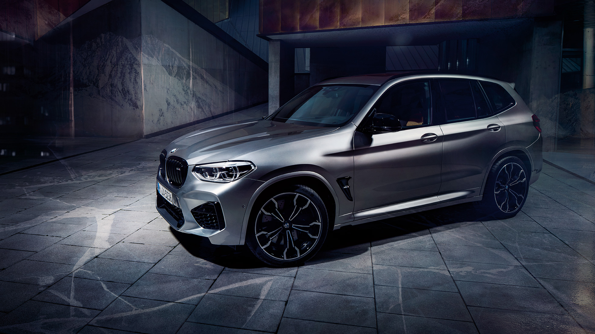 BMW X3 M Competition SUV, side view F97. BMW X3 M Competition SUV in Donington Grey metallic, exterior, side view F97.