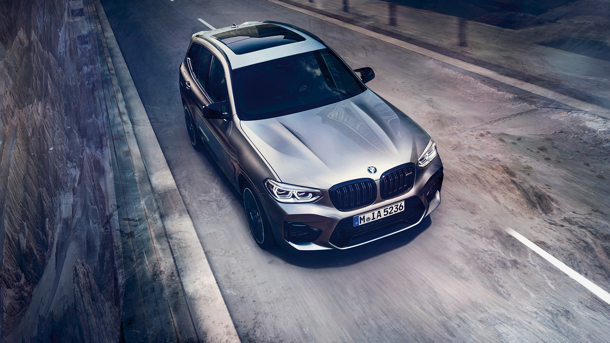 BMW X3 M Competition SUV, bird’s eye view F97. BMW X3 M Competition SUV in Donington Grey metallic, exterior, bird’s eye view of front F97.