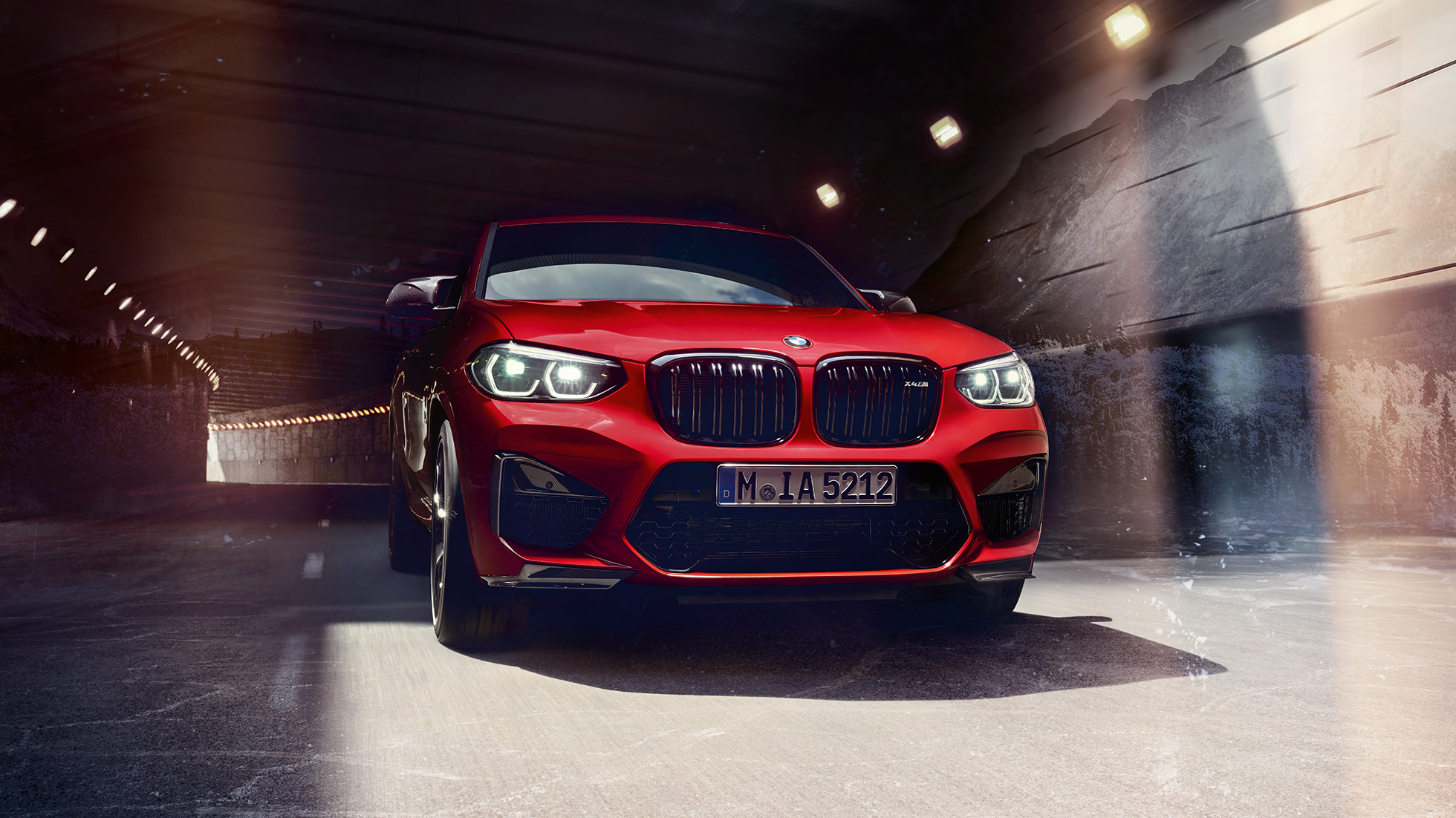 BMW X4 M Competition SUV, three-quarter front view F98. BMW X4 M Competition SUV in Toronto Red metallic, exterior, three-quarter front view F98.