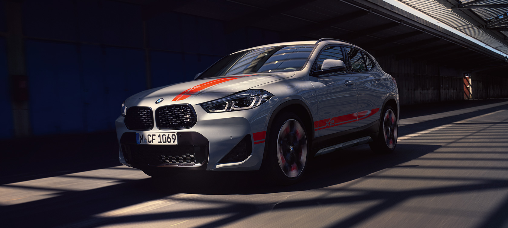 Three quarter front view BMW X2 SUV F39 Three quarter front view BMW X2 SUV 2020 F39 Brooklyn Grey in motion