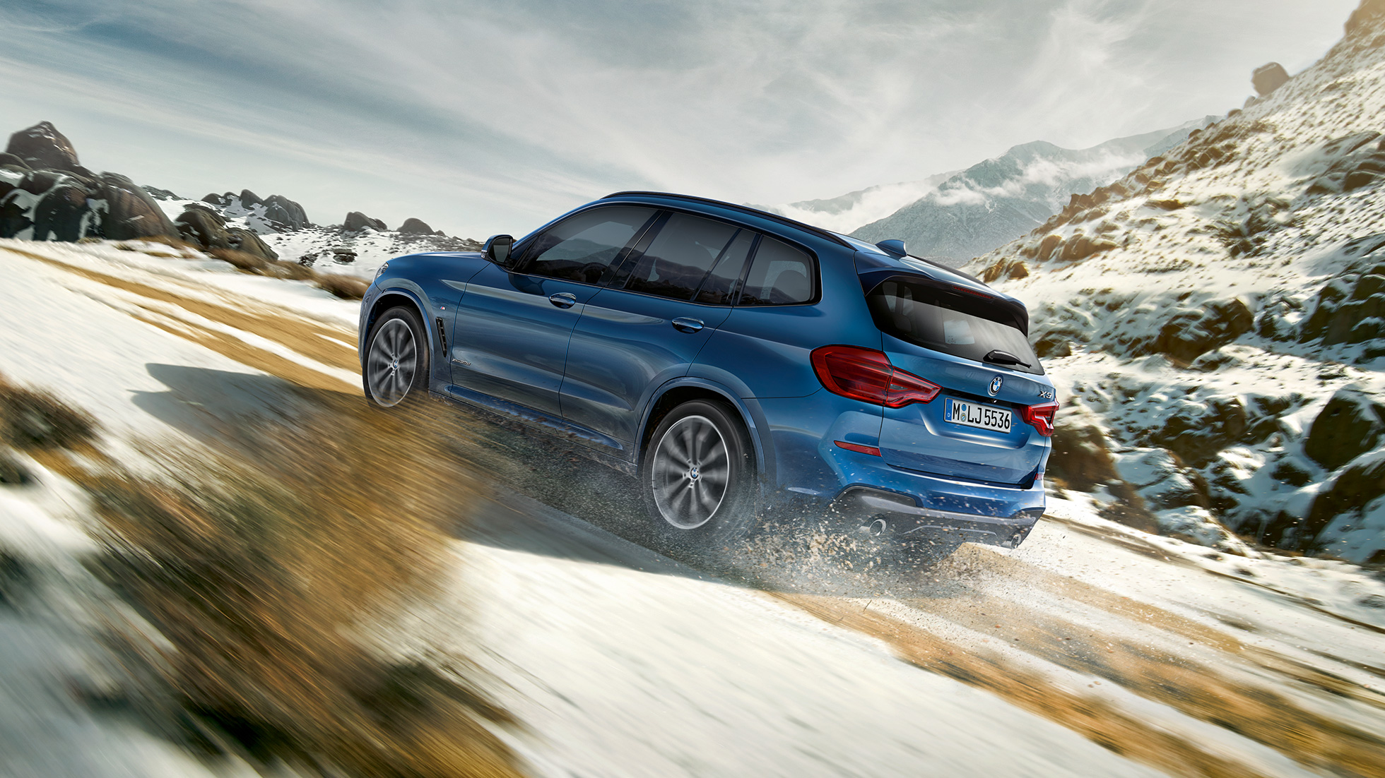BMW X3 M40i 2020 G01 three-quarter rear view driving BMW X3 M40i 2020 G01 uphill on serpentine three-quarter rear view driving
