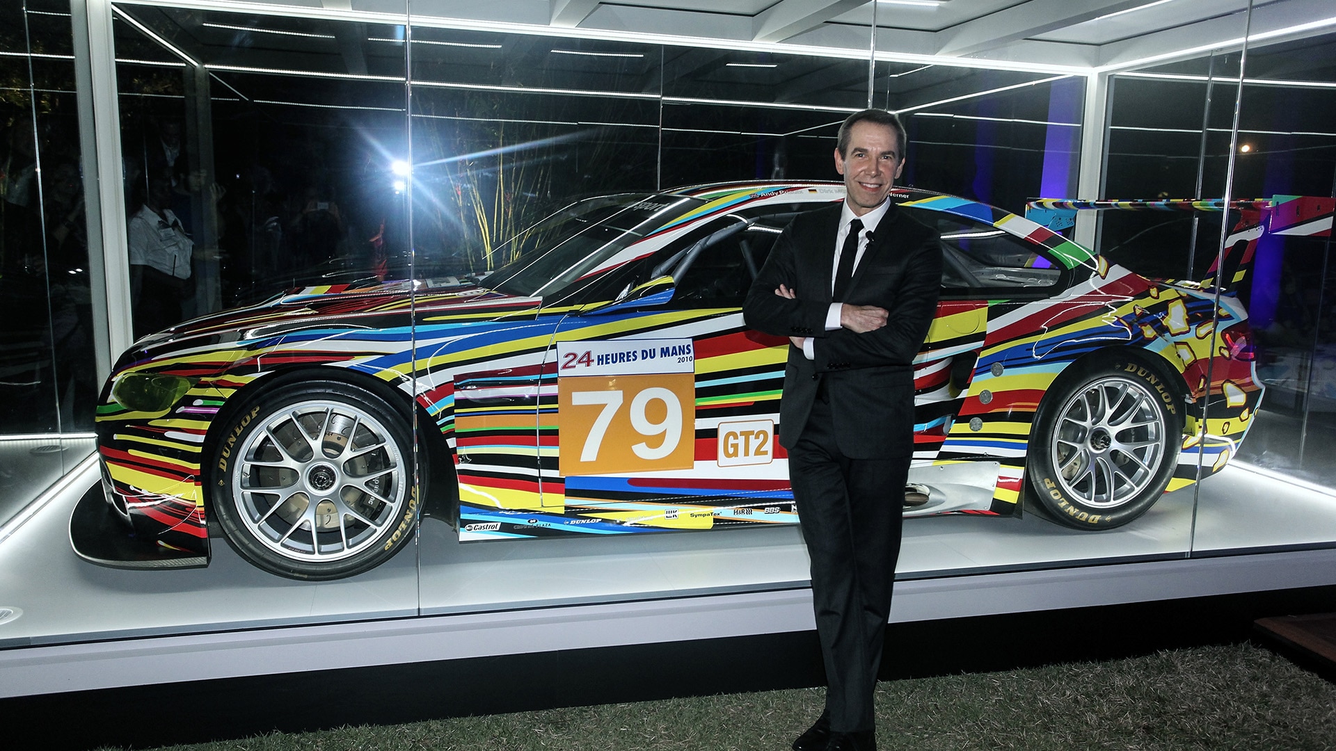 Koons and his 2010 BMW Art Car, a playfully re-painted BMW M3 GT2.