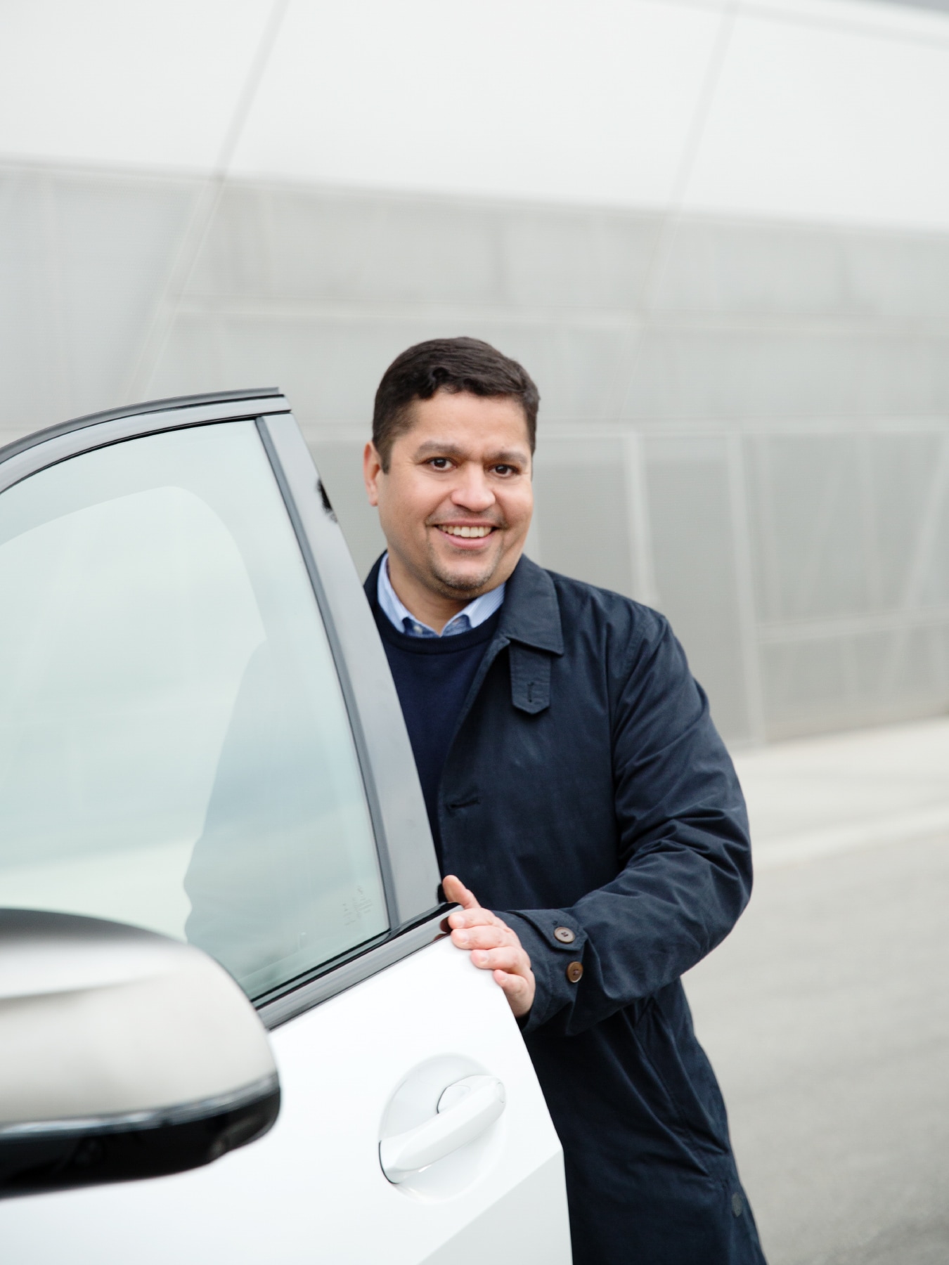 Dr. Abdelmalek Hanafi next to a BMW X7