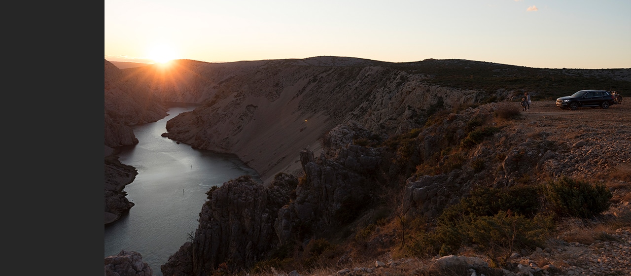 Sunset in the mountains on holiday with the car