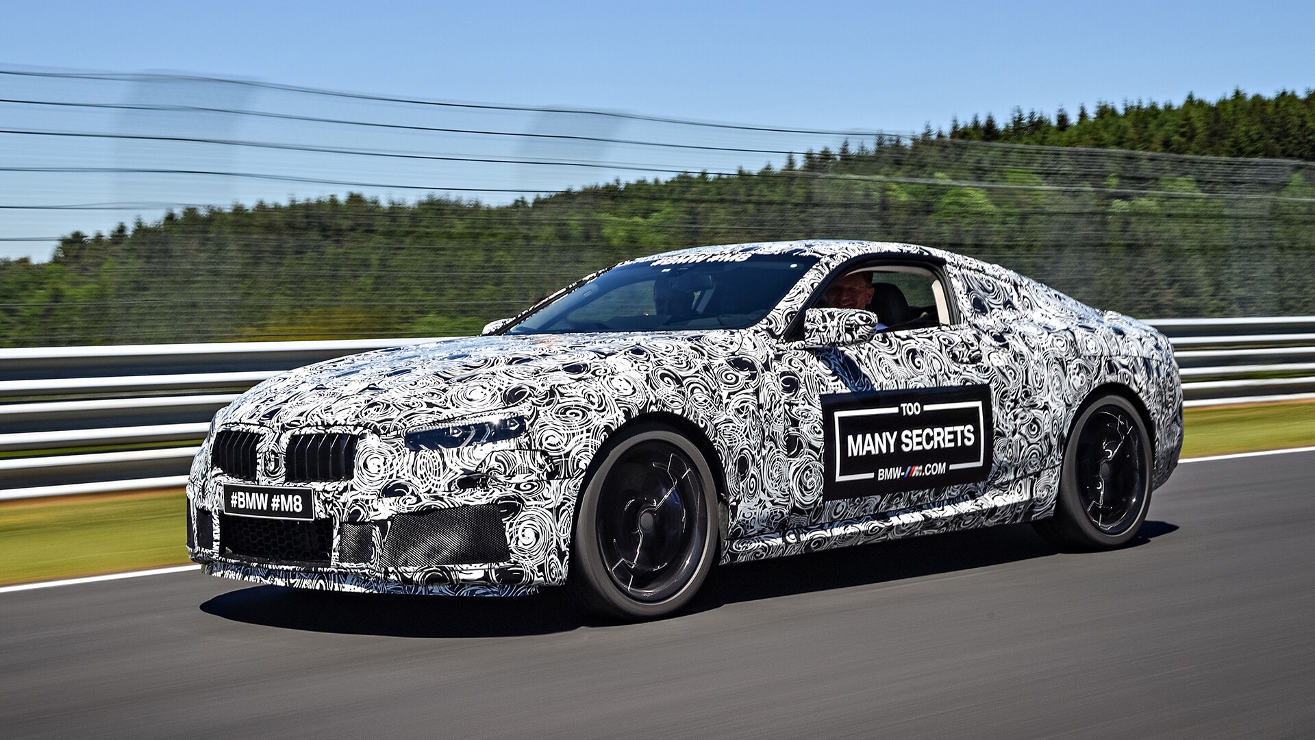 Camouflaged super sports car: the new BMW M8