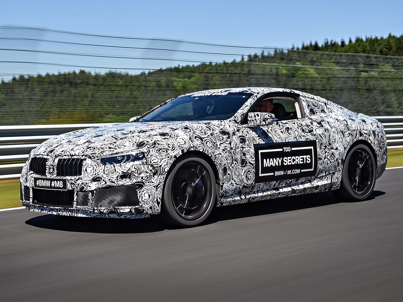 Camouflaged super sports car: the new BMW M8