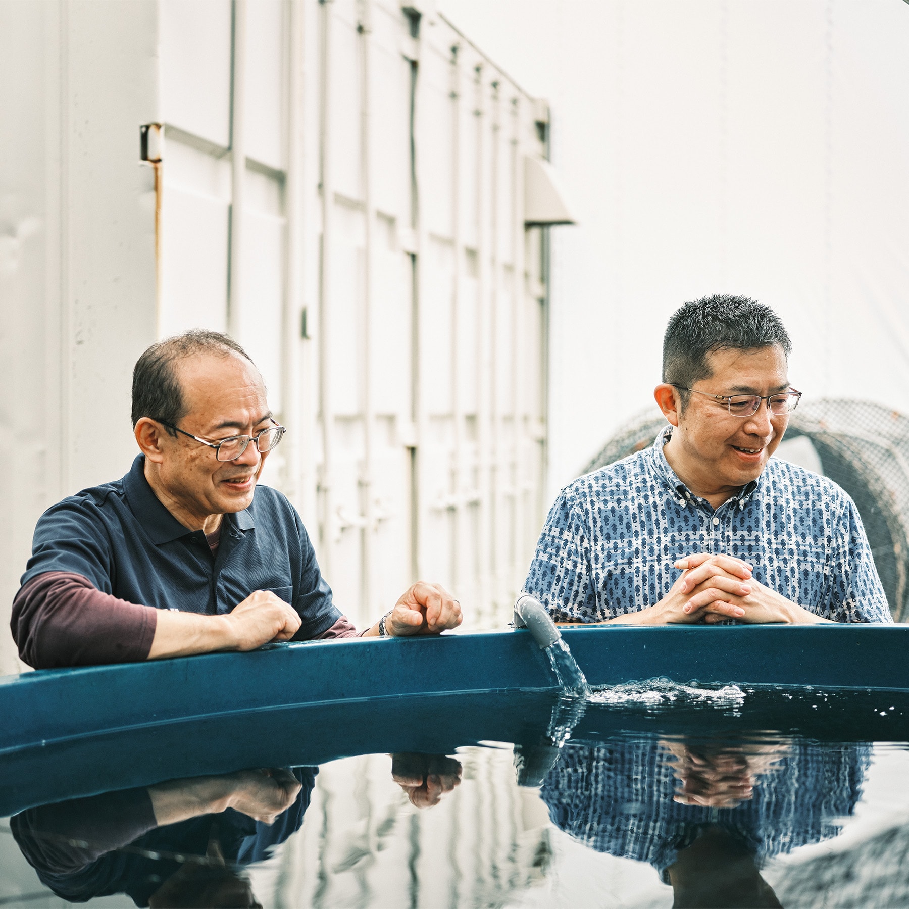 Hideaki Matsuo (right) and Dr. Yoshifumi Sawada, professor of the Aquaculture Research Institute, Kindai University, at the Oseto brothers’ sustainable fish farm.