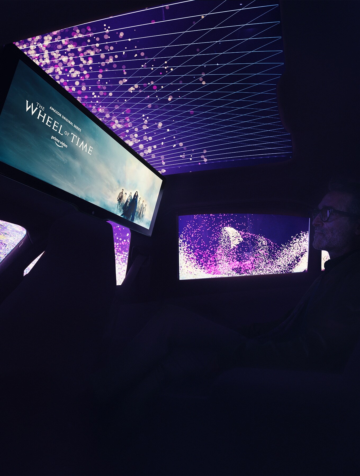 The rear seat becomes a private cinema on wheels
