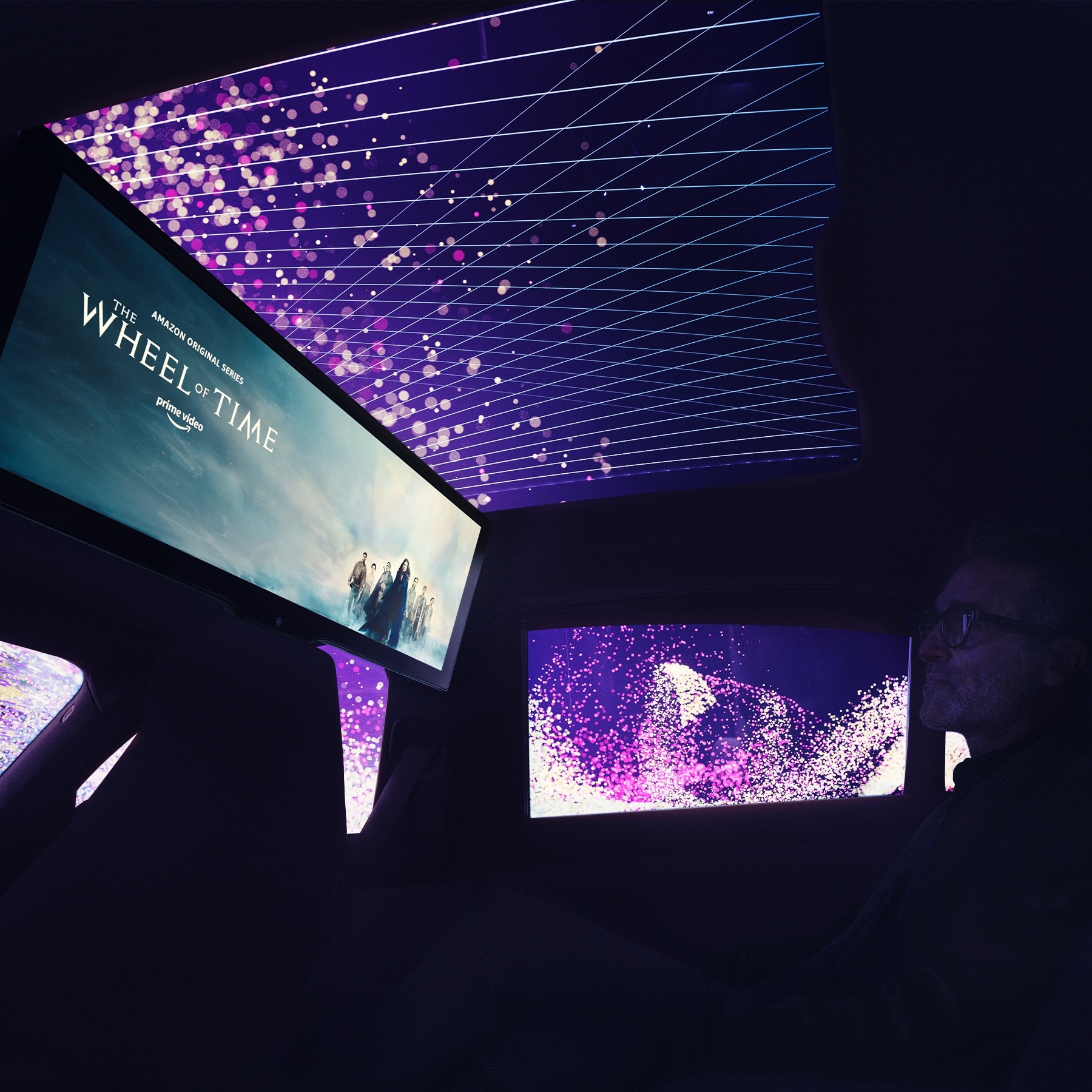 The rear seat becomes a private cinema on wheels
